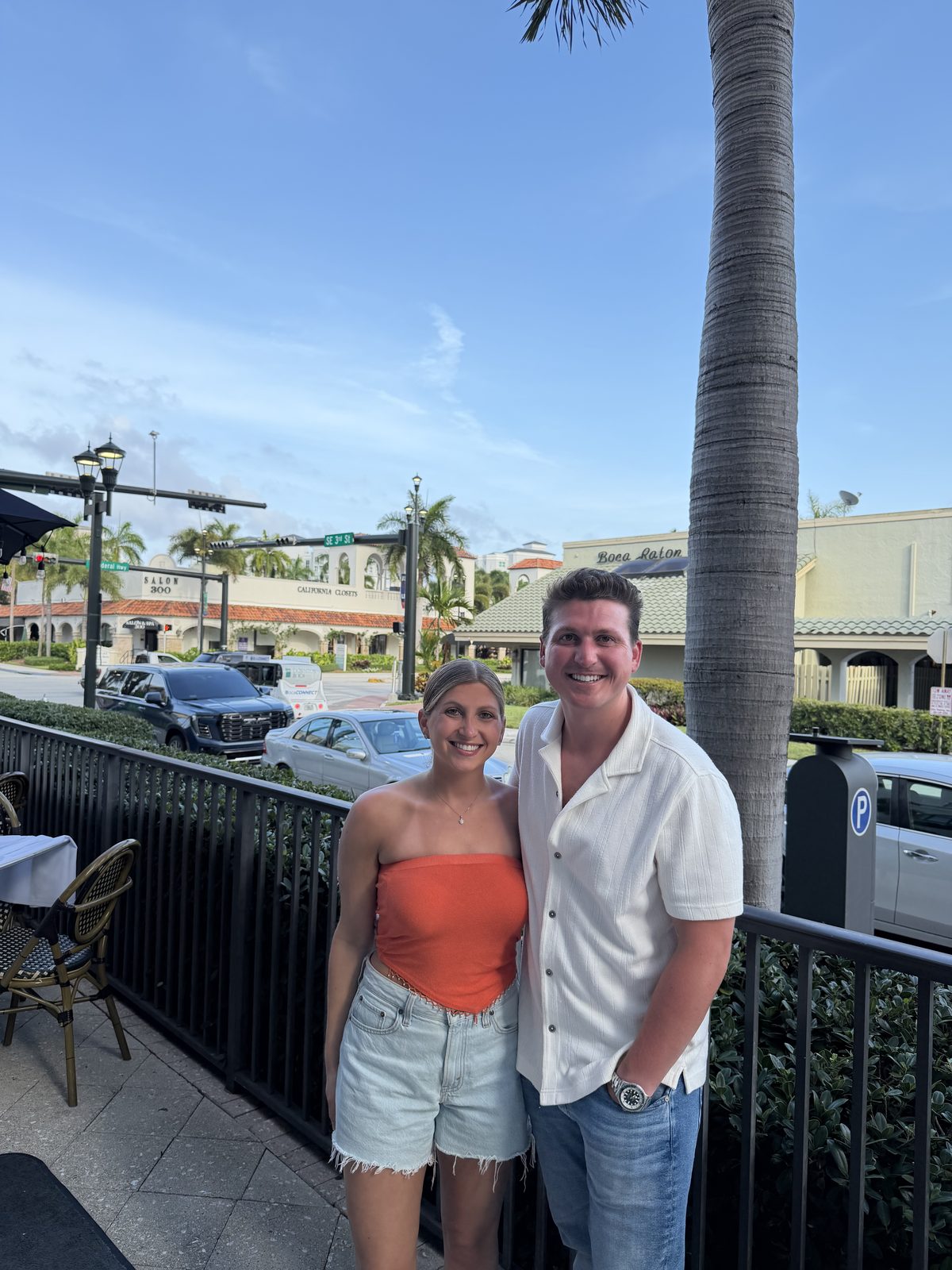 On a restaurant patio in Boca Raton under palm trees